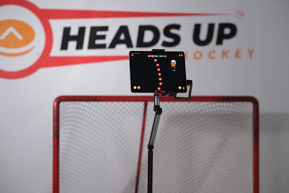 The adjustable stand supporting an iPad, mount and camera mirror during use; iPad not included